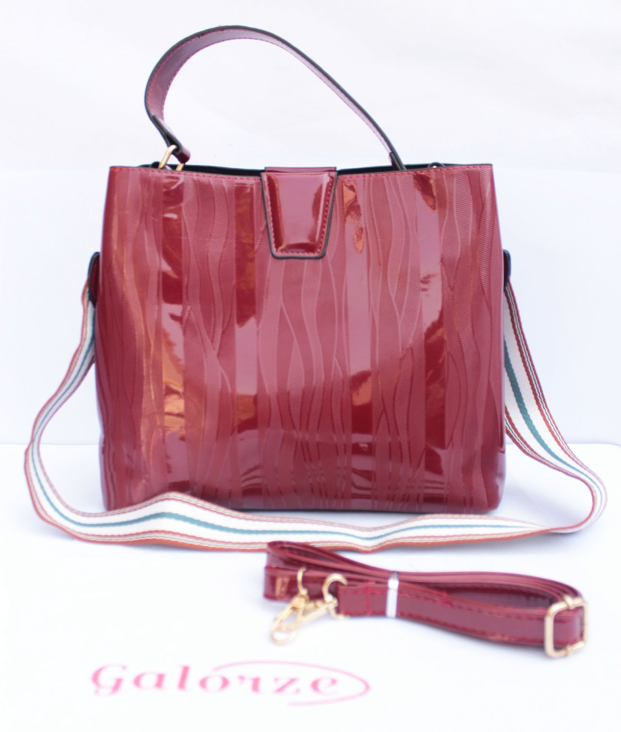 Galorze: Glossy red handbags for women and girls of all ages.